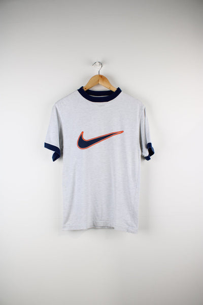 Vintage Nike 90s T-shirt in grey. Features printed logo across the chest in blue and orange.