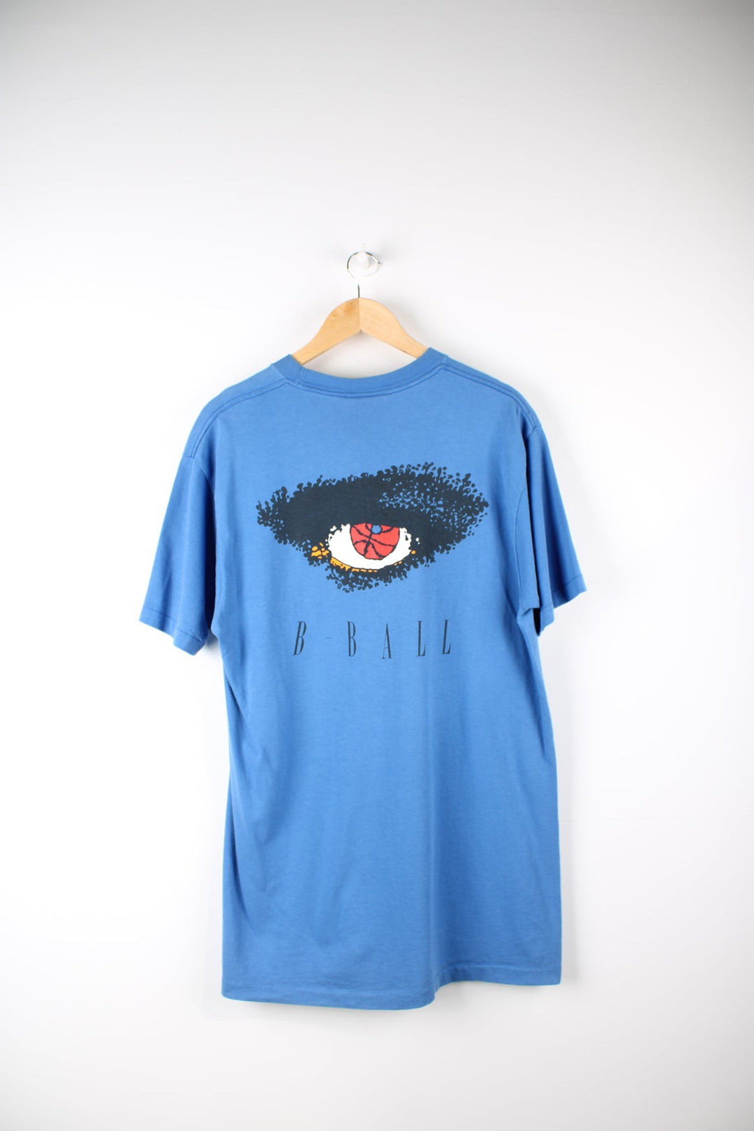 Vintage Reebok Basketball T-Shirt with printed logo on the chest and graphic print on the back.