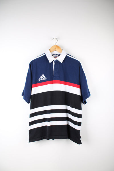 Vintage Adidas striped polo shirt with embroidered logo on the chest and signature three stripes on each sleeves.