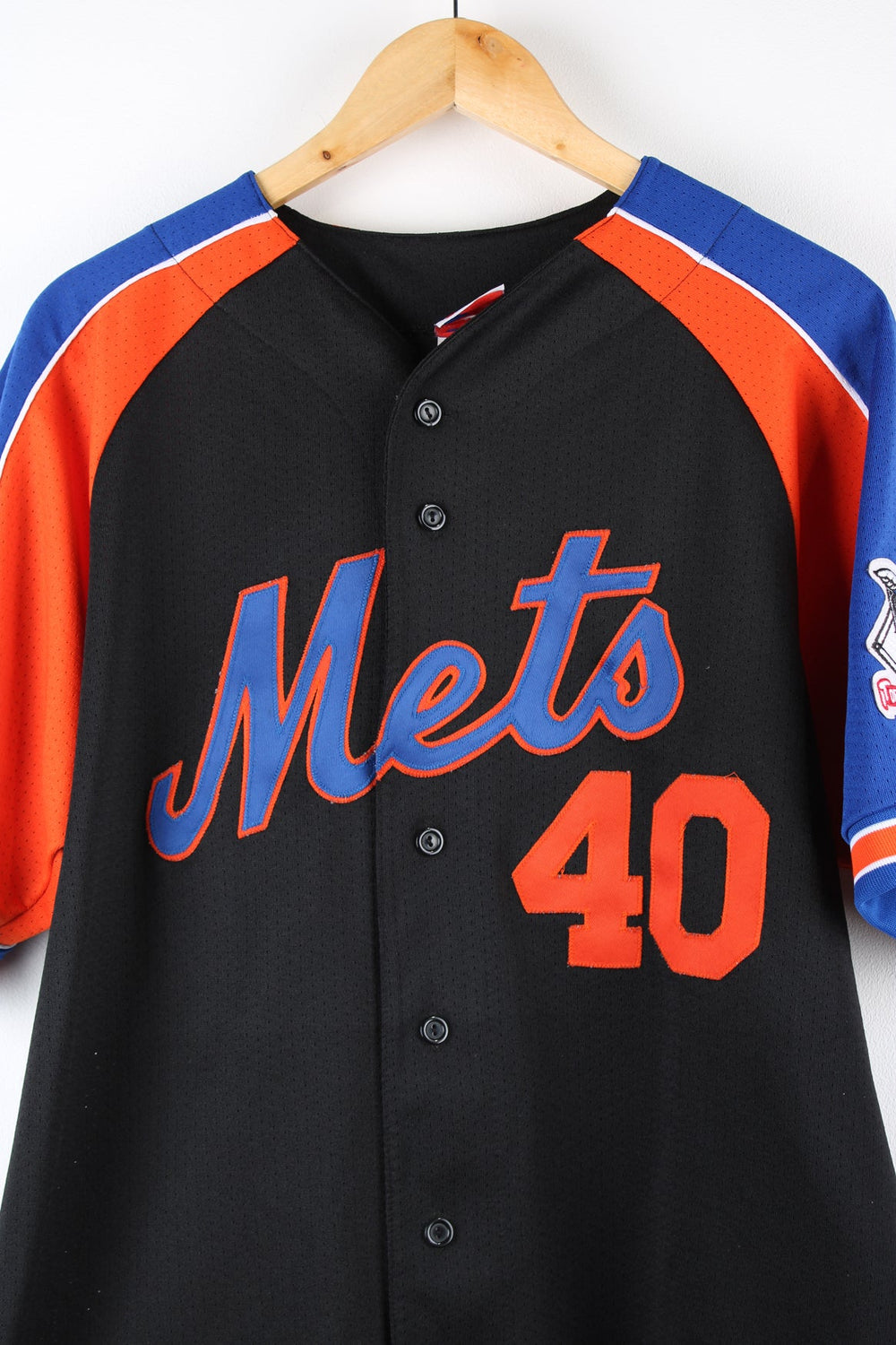 New York Mets MLB Baseball Jersey by Majestic in black, blue and orange. Features embroidered logo and badge.