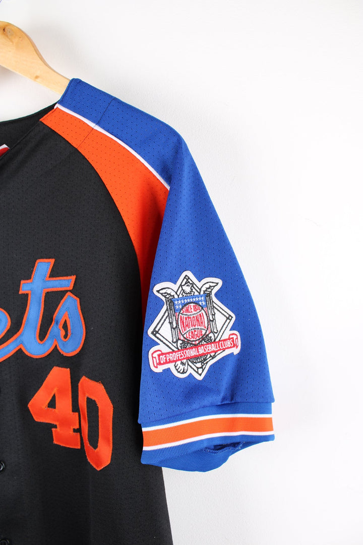 New York Mets MLB Baseball Jersey by Majestic in black, blue and orange. Features embroidered logo and badge.