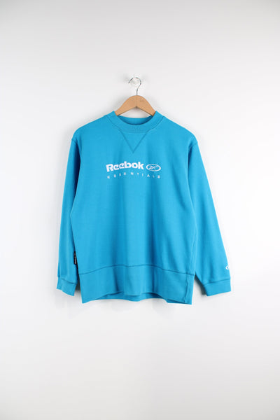 00's bright blue Reebok crewneck sweatshirt, features embroidered spell-out logo across the chest