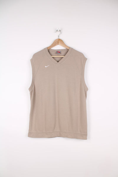 Vintage Nike sweater vest in beige featuring embroidered logo on the chest.