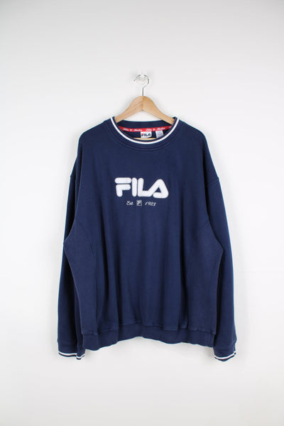 Fila sweatshirt in blue with embroidered logo across the chest with white teddy detailing on the letters.