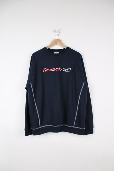 Reebok sweatshirt in navy blue with embroidered logo across the chest in red and white.