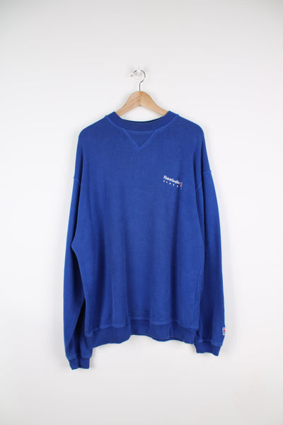 Vintage Reebok Classics blue sweatshirt with embroidered logo on the chest.