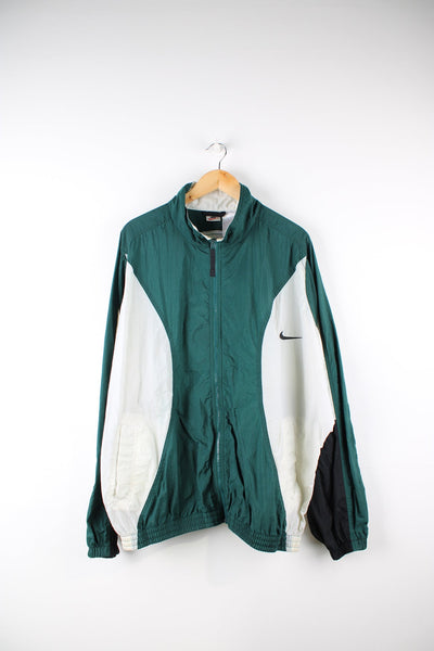 Vintage 90s Nike green and white tracksuit top. Features embroidered logo on the chest and back.