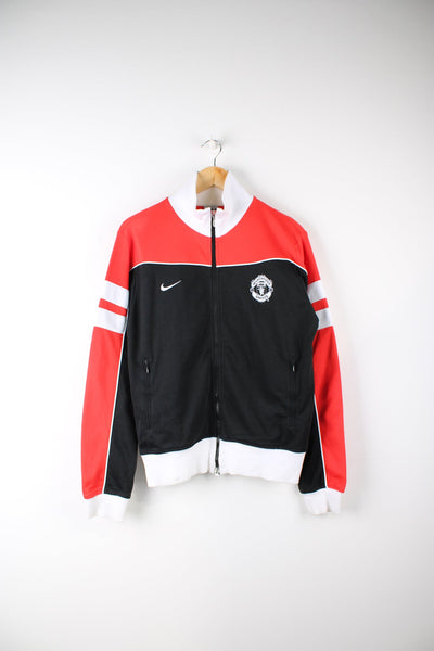 2005/06 Manchester United tracksuit jacket in black and red. Features embroidered badge and logo on the chest.