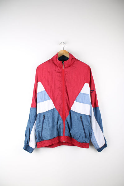 Vintage Puma shell jacket in red, with white, purple and blue panel details.