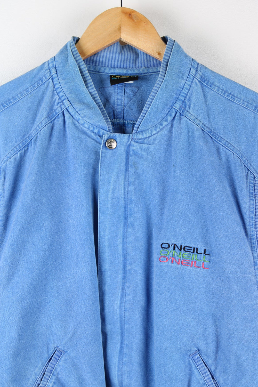 Vintage O'Neill blue zip through bomber style jacket. Features embroidered logo on the chest.