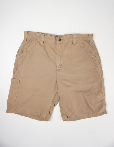 Carhartt brown carpenter shorts with multiple pockets and logo on the back pocket. good condition Size in Label: 36 Our Measurements: Waist: 36 inches Length: 10 inches (inside leg) Please ensure you check all measurements. ** All our items are pre-loved and as a result may show signs of wear due to the age of the product, for any questions about this or any other item please email hello@vintage-folk.com **